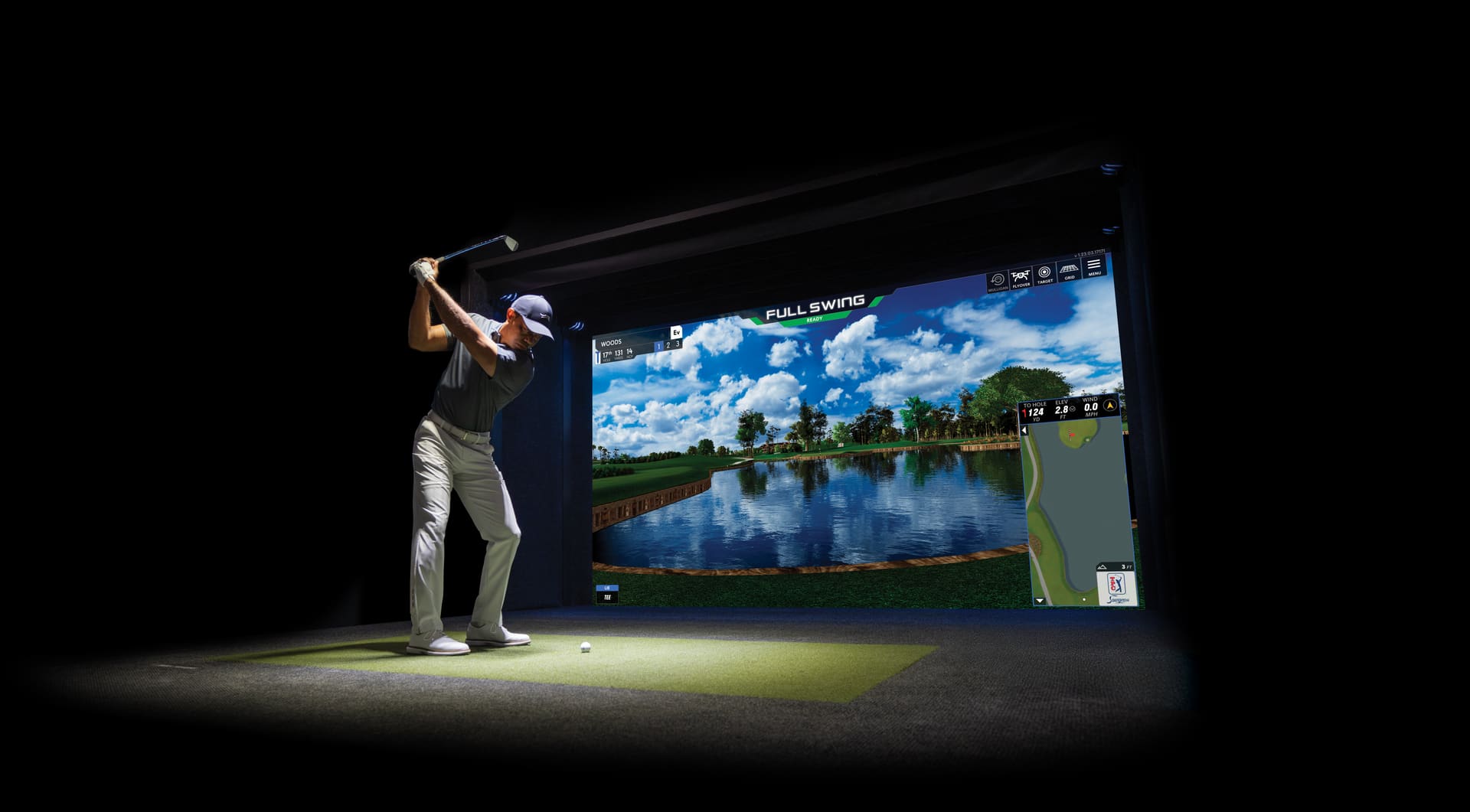 Indoor simulator bay — the Sawgrass island green on screen